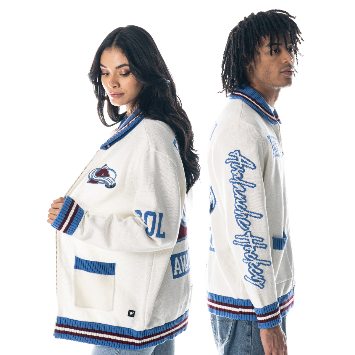 White full-zip knit with knitted graphics. The back area has a massive fully-colored Avalanche primary logo, alongside the words "Colorado Avalanche Hockey. On the neck, waist, and wrists is a white and red line pattern runs across a baby-blue background. A small Avalanche logo is on the left breast along with "COL" on the left arm. A massive Avalanche logo and "Colorado Avalanche Hockey" on the back area. "Est. 1995" is on the right breast, with "Avalanche Hockey" on the right arm.