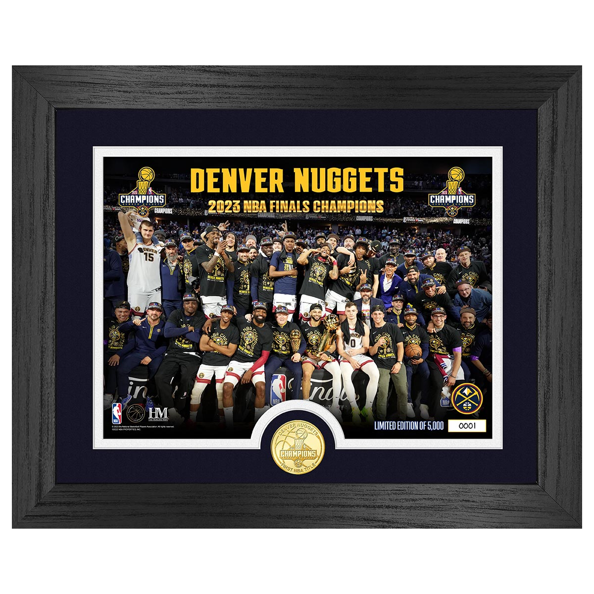 Denver Nuggets 2023 NBA Finals Champions Team Picture, Players Standing across the back with other players sitting upfront on the award stage. Taken post Game 5 win. Players wearing NBA finals champion shirts. Frame included black wood/blue paper outline.