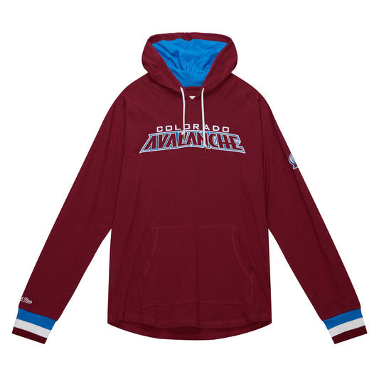 Front image of burgundy long sleeve with lined hood in blue. Kangaroo pocket. Wristbands are blue, white, and burgundy. Right wrist has embroidered white "Mitchell & Ness" logo. Left sleeve has small full color Avalanche logo just above elbow. 