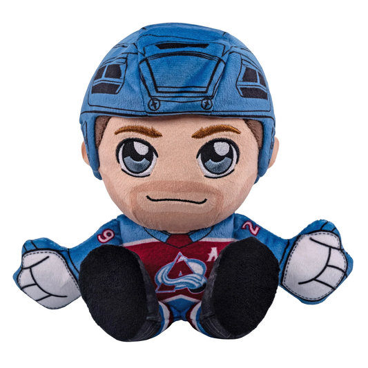 This plush toy is of current Colorado Avalanche center Nathan Mackinnon. The helmet and gloves are a blue color. while the skates are black. The Jersey is the Colorado Avalanche home jersey. which is burgundy and blue. On the front of the jersey it has the primary avs logo, with an "A" patch on the upper right to signify Mackinnon's alternate captaincy. On the back of the Jersey it has "Mackinnon" with his number "29" right below it. On the arms it has "29" in a white color.