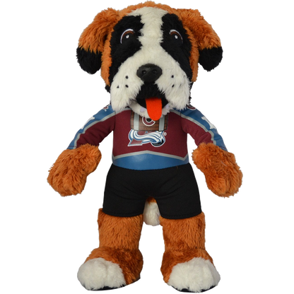 This plush toy is a design of the Colorado Avalanche mascot Bernie. Bernie got that dog in him, as he is a mountain dog. He is wearing the Avalanche Home jersey, which is primarily Burgundy, with blue and white outlines. His number is a dog bone, which is on both arms, and on the back of the Jersey right under his name "Bernie". He is a brown dog with white on his feet, and black and white face spots.