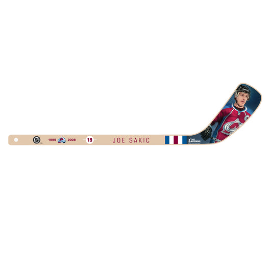 Wooden Mini Hockey stick with former Avalanche player Joe Sakic on the blade. On the shaft of the stick it has the date of the time Sakic spent playing for the team with his retired number "19".